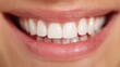 © Plaifah - Close-Up View of a Bright and Healthy Smile with Perfectly Aligned White Teeth and Subtle Pink Lips Against a Soft Background for Dental Health Themes