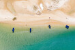 © Austockphoto - Aerial view of 4 small pleasure boats anchored in turquoise water off a coastal beach