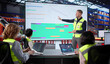© Andrey Popov - Warehouse Workers Meet With Manager, Analyze Data On Laptop Screen