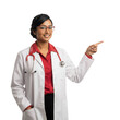 © Napapon - Friendly Indian doctor points to health care solutions here, isolated on transparent background