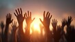 © Johannes - diverse hands reaching up together symbolizing unity teamwork and collaboration against a warm sunset background