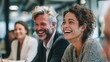 © Johannes - professionals laughing together during a brainstorming session in a modern office business team fun office collaboration laughter corporate team joy workplace camaraderie with