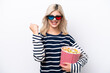 © luismolinero - Young Russian woman isolated on white background with 3d glasses and holding a big bucket of popcorns