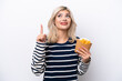 © luismolinero - Young Russian woman catching french fries isolated on white background intending to realizes the solution while lifting a finger up