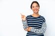 © luismolinero - Young hispanic woman isolated on white background pointing finger to the side