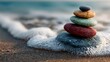 © horizon - Serene close-up of a small pile of smooth, multi-colored pebbles resting on wet sand at the beach, with the soft foam of a wave receding.