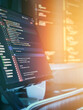 © Maximusdn - Modern programming workspace with glowing code display