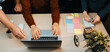 © InfiniteFlow - A dynamic workspace showcasing diverse hands collaborating around a laptop, surrounded by colorful sticky notes, highlighting creativity and teamwork in action. SACTR