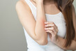© Pormezz - Sensitive skin allergic concept, Woman itching on her arm have a red rash from allergy symptom and from scratching.