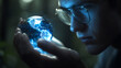 © raseldesigner93 - Young man with glasses holding glowing blue earth hologram image