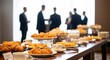 © Fa_art - Business breakfast at conference event catering during company seminar close up view Coffee and croissants on table with colleagues at background