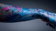 © Jojo* - Close-up of an arm covered in vibrant blue and pink paint splatters, creating an abstract and artistic effect.