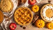 © zahra - An overhead view of various homemade pies, fresh apples, small pumpkins, and cinnamon sticks arranged on a rustic table, perfect for autumn celebrations.