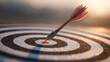© narumon - Close-up of an arrow striking the target precisely in the center, symbolizing success, goal achievement, determination and precision in life or business.