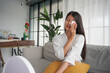 © Wanda - Asian woman in bathrobe applying skincare, take care of your facial skin