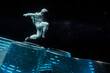 © Rendara Studio - 3D astronaut jumping in space over tech surface