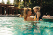 © Jacob Lund - Mother and daughter enjoying a luxurious vacation swimming together