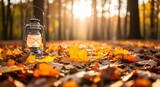 Vintage lantern illuminates autumn leaves in a forest setting