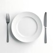 © FOYSAL - Empty white plate with fork and knife set for dining