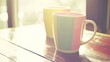 © abdul - Colorful Ceramic Coffee Mug on Wooden Table Near Sunlit Window