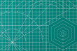 © Gresei - Green cutting mat surface with grid and measurement lines
