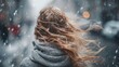© Bargais - Close-up woman's hair, with snow falling in the city.