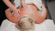 © Наталья Добровольска - Professional hands performing massage giving blonde woman deep relaxation.