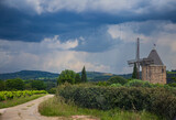 Small old mill in a village in Provence, France. Stormy day in summer.