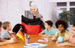 © JackF - in geography lesson, students carefully listen to woman teacher who talks about Germany