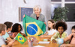 © JackF - teacher is involved in lesson and conducts survey of students about nature of Brazil