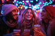 © Milos - Three friends share laughter and warm drinks surrounded by colorful lights in a cozy winter atmosphere, embodying warmth and joy during the festive season together.