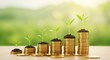© Tri - Stacks of coins with growing plants symbolize financial growth and prosperity