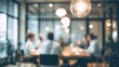 © Yevhen - Collaborative business meeting  blurred image of professionals engaged in discussion at table