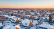 © ajib ajib - Panoramic winter landscape of suburban homes covered in fresh snow under a pastel sky