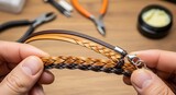 Detailed view showcasing braided leather craftsmanship in jewelry making process