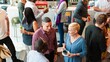 © Rawpixel.com - Diverse group socializing at a casual gathering. People chatting, enjoying drinks. Relaxed atmosphere, diverse crowd, lively conversation, casual setting. People mingle at a busy social event.