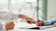 © FlexOn/peopleimages.com - Hands, business people and signature on contract for legal agreement, financial deal or pointing. Sign document, office or writing on form for investment application, terms and conditions with client