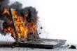 © fannybuddhies - A laptop computer is engulfed in flames and smoke, possibly due to overheating, malfunction, or a deliberate act of destruction, symbolizing technology failure and data loss.