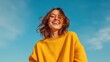 © xartproduction - Young woman with a bright smile enjoying a sunny outdoor day.