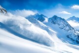 Powerful avalanche cascading down snowy mountain slope