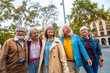 © unai - Happy senior friends traveling together enjoying city tourism