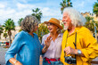 © unai - Senior friends enjoying city vacation happy conversation