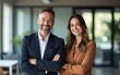 © Daniel - Happy confident professional mature business man and business woman corporate leaders managers standing in office, two diverse colleagues executives team posing together, portrait. High quality