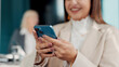 © FlexOn/peopleimages.com - Business meeting, hands and typing with phone for planning, review agenda and boardroom gathering. Online resources, digital programme and manager preparing for workshop, research info and woman