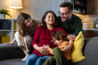 © NDABCREATIVITY - Happy family with pregnant mother and cute children have a fun at home and hug each other