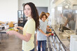 © Robert Kneschke - Students enjoying lunch in a school cafeteria with fresh and healthy food