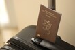 © mehaniq41 - Luxembourg passport on touristic baggage luggage in airport close up. Travel and tourism in Europe concept