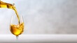 © senadlife - A captivating image showcasing a golden liquid being poured into a clear glass, highlighting the smooth texture and alluring color of the drink against a soft background.