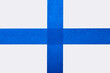 © Tetra Images - Strips of blue tape on white background