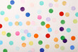 © Tetra Images - Colorful confetti on white background